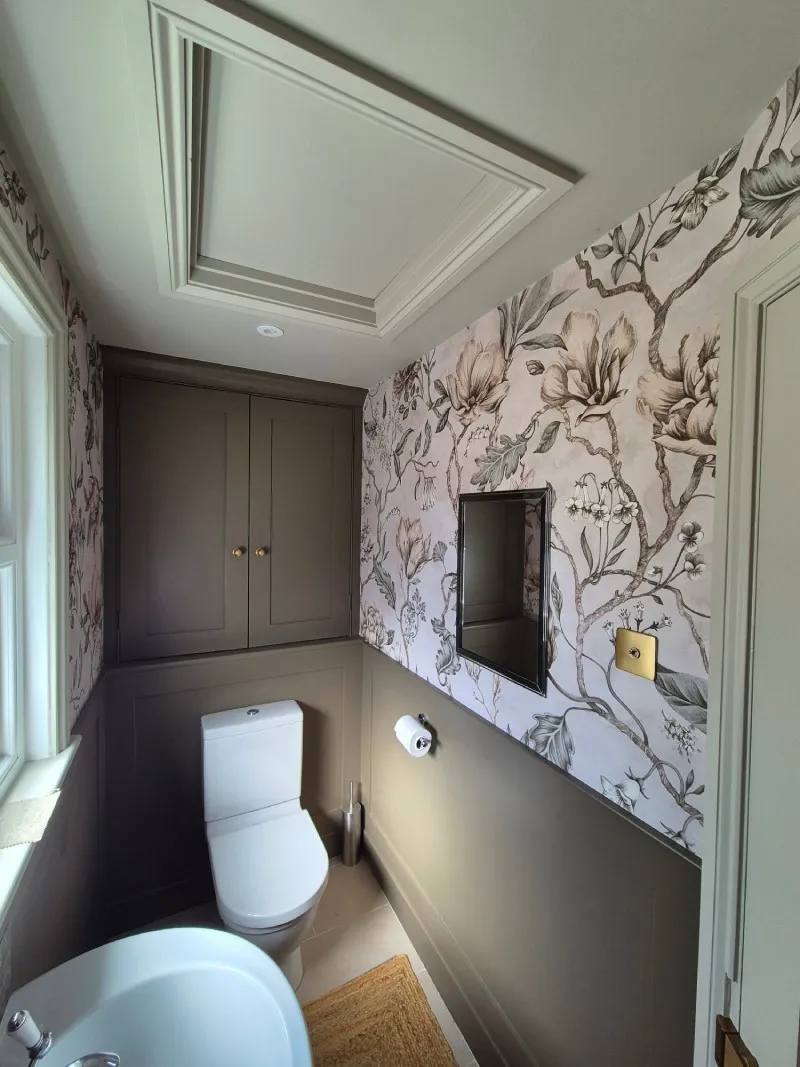 Cloakroom after redecoration in forest green